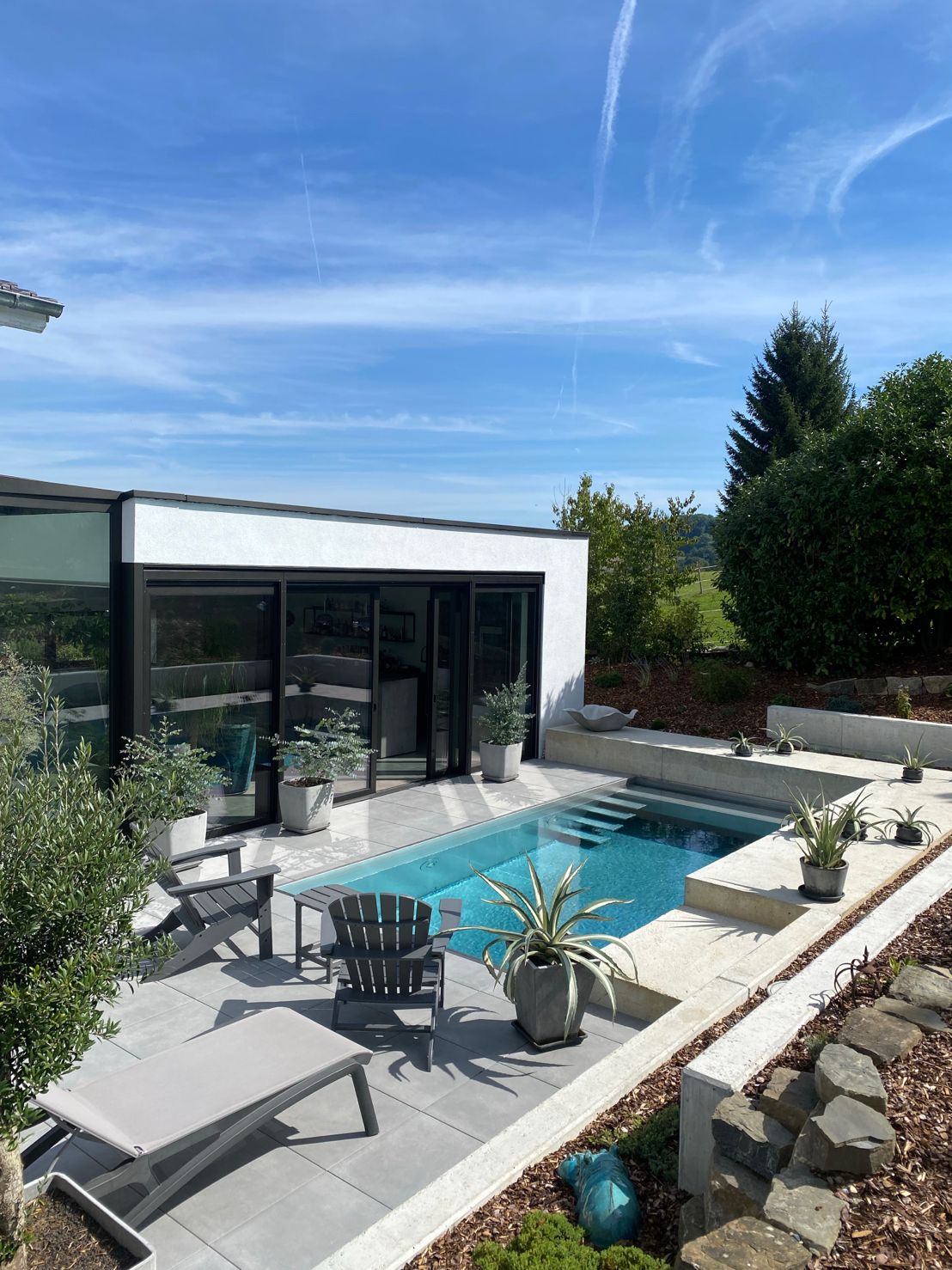 white concrete building with swimming pool